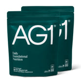 AG1 Greens Powder tub front showing compact all-in-one daily supplement for gut health.
