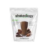 BODi Shakeology chocolate, envase de proteína vegetal, ideal para saciar hambre con energía estable.