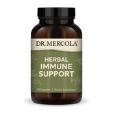 Dr. Mercola Herbal Immune Support: botella en escritorio, conveniente para uso diario.