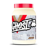 Proteína vegana GHOST con sabor chocolate-leche-cereal en empaque de 2 lb para batidos.