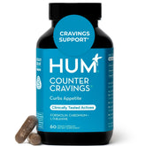 Hum Counter Cravings: botella derramando cápsulas para apoyar hábitos diarios.