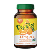 MegaFood Complex C frasco de tabletas con naranja real, apoyo diario de la inmunidad.