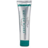 Pasta dental Melaleuca blanqueante en envase, frescura de menta para uso diario.