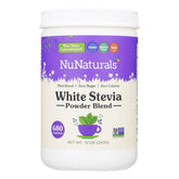 NuNaturals Stevia en polvo blanca junto a una taza, endulza bebidas sin calorías