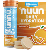 Nuun naranja cítrica: tableta disolviéndose en agua para hidratación y apoyo inmunitario