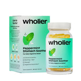 Wholier botella de vidrio con aceite de menta y jengibre para alivio digestivo.