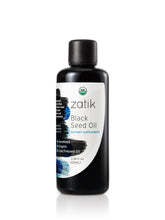 Aceite de comino negro Zatik Naturals en envase de vidrio para cabello y piel.