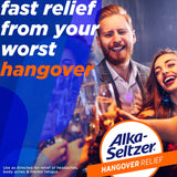 Burbujeante solución de Alka-Seltzer naranja para alivio rápido tras consumo.