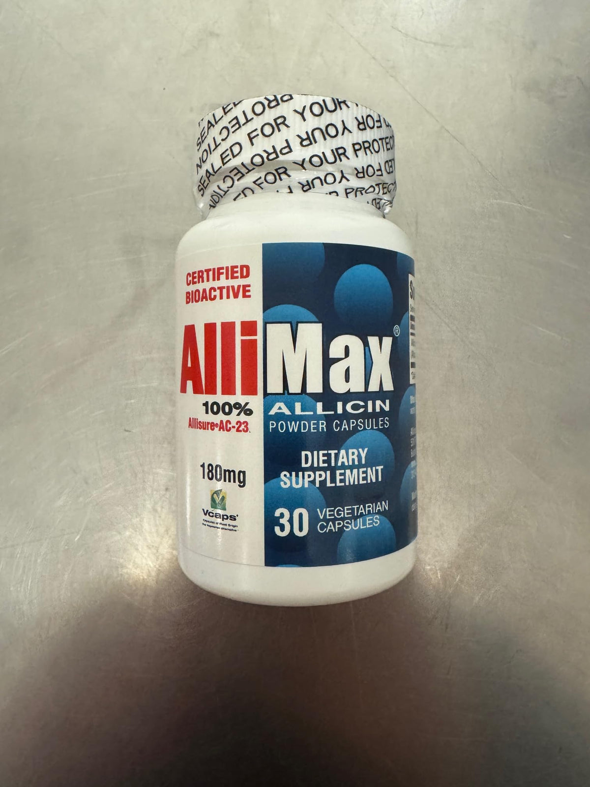 Allimax 180 mg cápsulas, botella frontal, uso diario y conveniente.