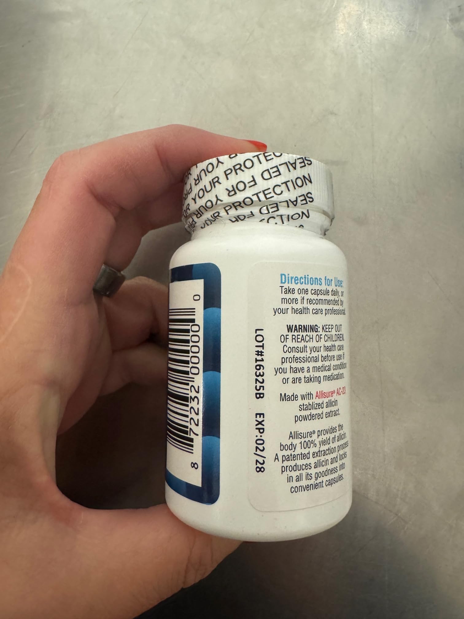 Allimax 180 mg en caja, empaque compacto para almacenamiento.