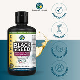 Aceite Amazing Herbs Nigella Sativa y semillas visibles, fuente natural de nutrientes.