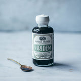 Viridem Greens Detox Elixir, etiqueta cercana con notas cítricas y hierbas