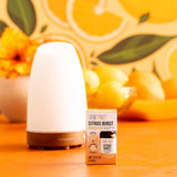 Aura Cacia Citrus Burst mezcla cítrica para energizar espacios.