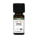 Aura Cacia Copaiba, botella de aceite esencial, ideal para aromaterapia y cuidado de la piel.