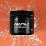 AX Nutrition Creatina + Electrolytes, cuchara de medición incluida para mezclar en agua.