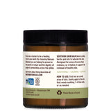 Banyan Botanicals bálsamo con neem y vetiver, aplicación calmante para la piel.