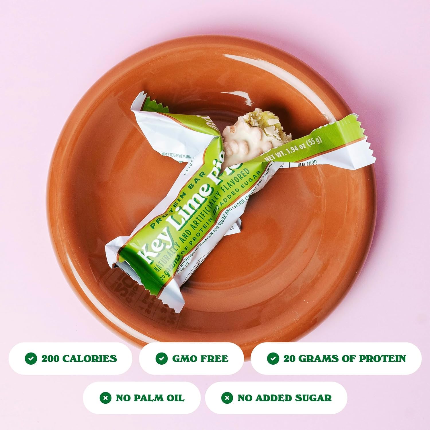 Barebells barra proteína muestra textura suave y relleno cítrico cremoso.