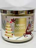 Bath & Body Works Merry Cookie vela 3 mechas, perfuma salones y crea ambiente acogedor.