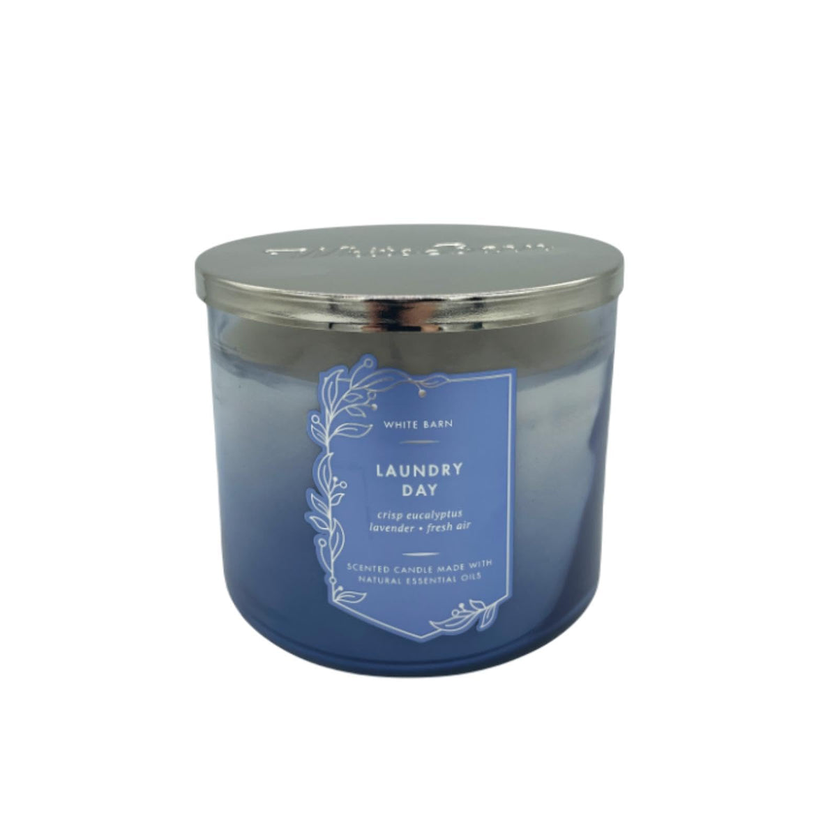 Vela Bath & Body Works White Barn, 3 mechas encendida para un ambiente fresco.