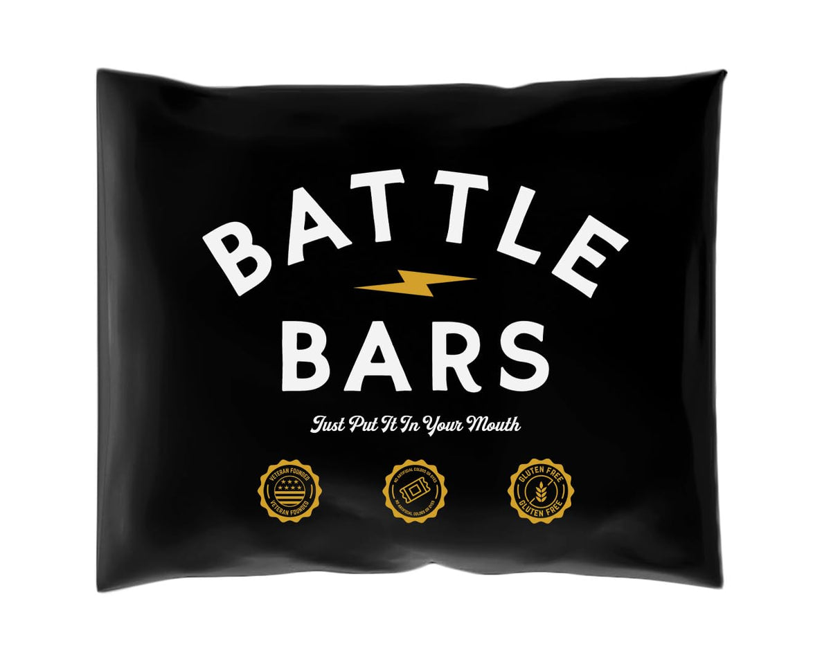 Battle Bars muestra cinco sabores en un paquete, snack rápido y proteico.