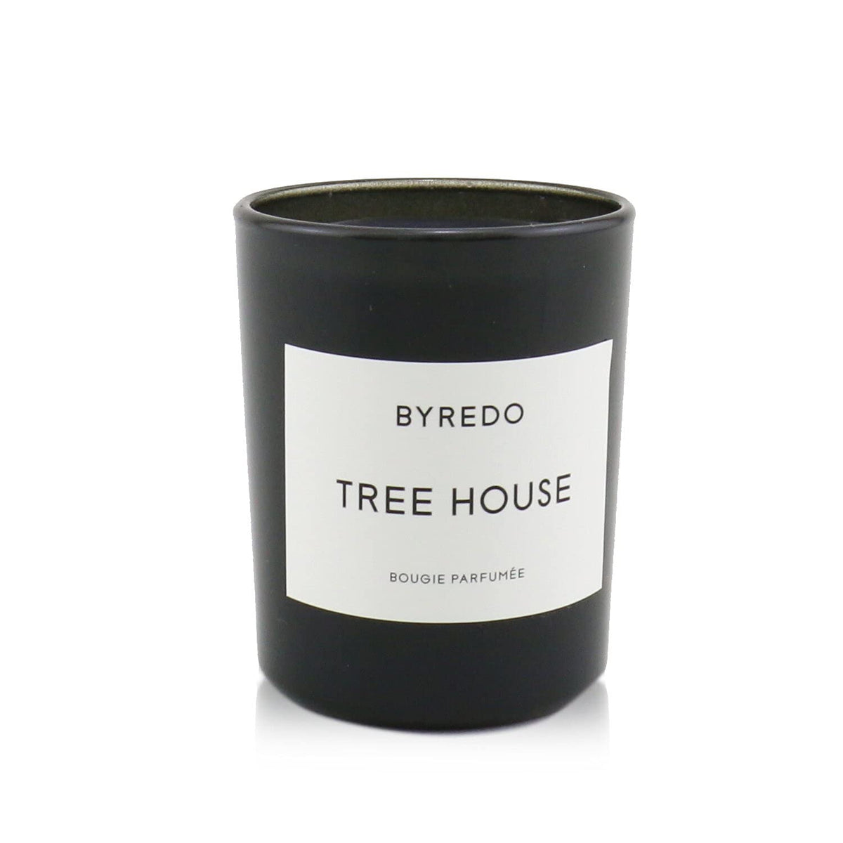 Vela Byredo Casa del Árbol en vaso transparente para sala elegante.