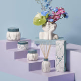 Bote de vidrio Capri Blue Volcano Marble añade elegancia decorativa