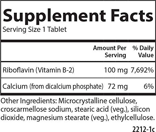 Carlson B-2 Riboflavina: tableta en mano lista para tomar.