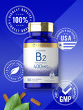 Píldoras Carlyle B2 400 mg en mano, lista para consumir.