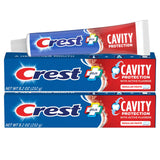 Crest: dos tubos de pasta 8.2 oz para uso diario.