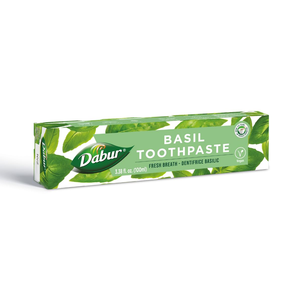 Pasta dental Dabur con albahaca, envase verde para una higiene suave.