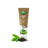 Dabur dentífrico té verde, primer plano del tubo, promueve encías saludables y frescura.