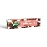 Dabur pasta dental de hierbas con clavo para limpieza suave y aliento fresco.