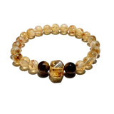 Pulsera Dare to Mystic con cuarzo rutilado dorado, brillo que inspira claridad y enfoque.