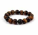 Pulsera Dare to Mystic con ojo de tigre y cuentas 12mm, ideal para enfoque diario.