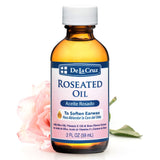 Aceite Roseated de De La Cruz en botella ámbar para conservar frescura y eficacia