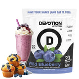 Devotion Nutrition proteína en polvo de arándano salvaje en taza para batido rápido.