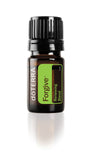 doTERRA Forgive: foto del frasco vertiendo, apoyo a liberación emocional y alivio de tensiones.