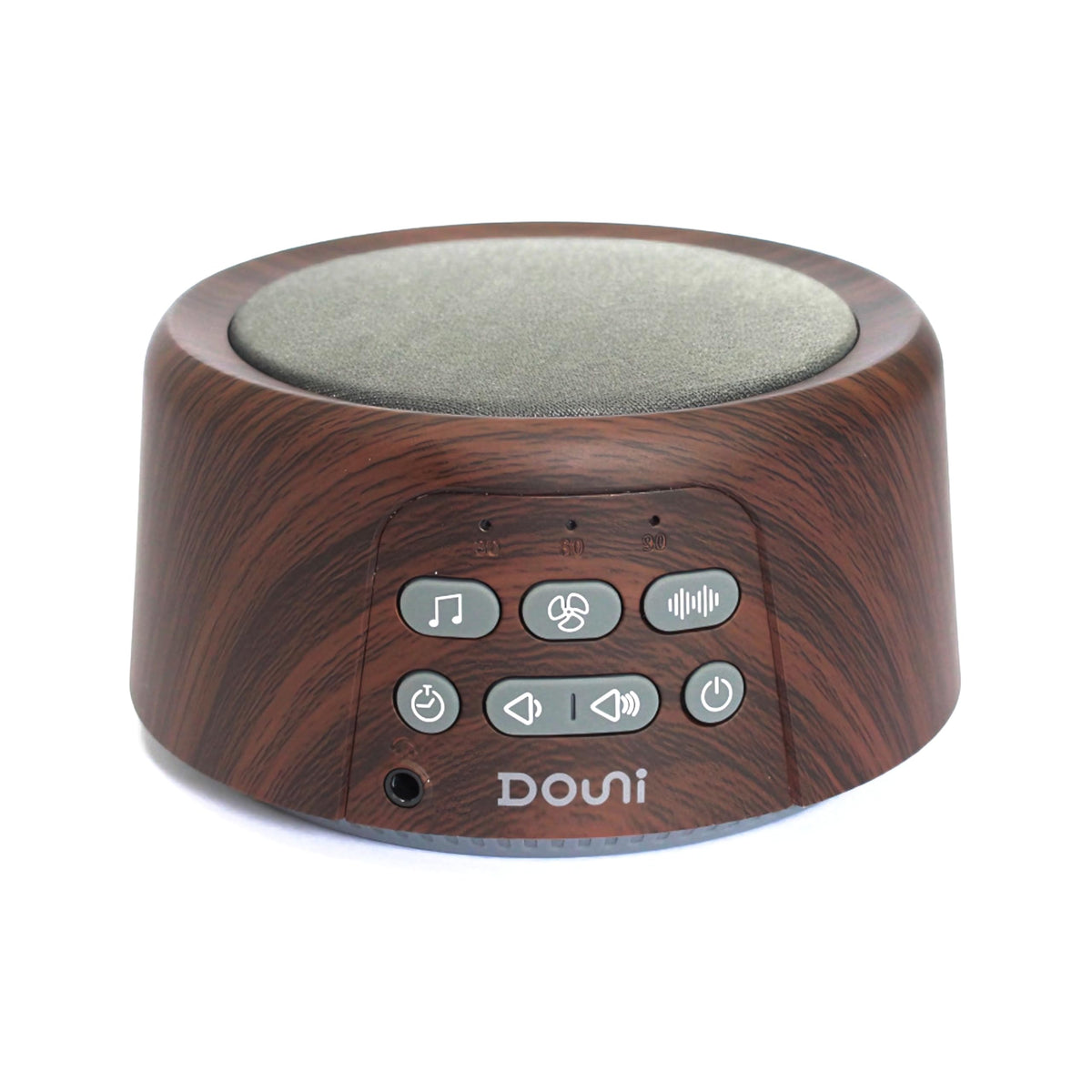 Douni máquina de ruido blanco con acabado madera marrón sobre mesita.