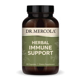 Dr. Mercola Herbal Immune Support: botella en escritorio, conveniente para uso diario.