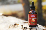 Dragon Herbs Reishi Drops, etiqueta visible, producto premium para uso diario.