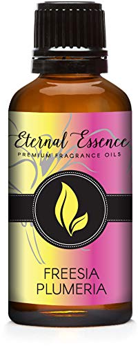 Frasco Eternal Essence Oils Freesia Plumeria en bote ámbar de 30 ml para ambientar.