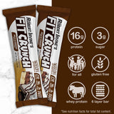 FITCRUNCH barra proteína bocado cremoso, sabor leche y galletas.