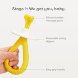 Mango ergonómico de silicona Frida Baby, agarre cómodo para manos pequeñas.