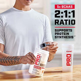 GNC Pro Performance Essential Amino Complete, bebida vertida con sabor naranja agrio para entrenamiento.