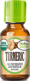 Healing Solutions aceite esencial cúrcuma en botella para cuidado de piel y cabello.