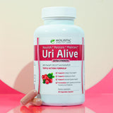 Uri Alive, cápsulas en manos, preparado para apoyo diario a la salud urinaria
