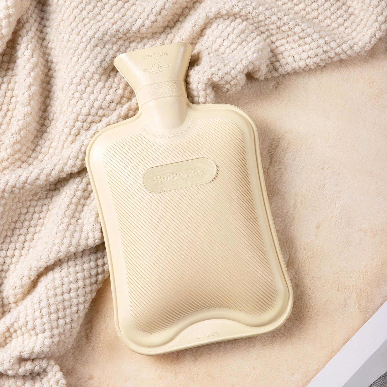 HomeTop bolsa de agua caliente caucho natural ofrece calor sostenido y tacto suave