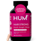 Cápsulas HUM Hair Strong en botella frontal, apoyo al cabello saludable.