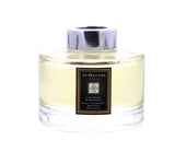 Difusor Jo Malone con fragancia cítrica y frutal para salones elegantes.