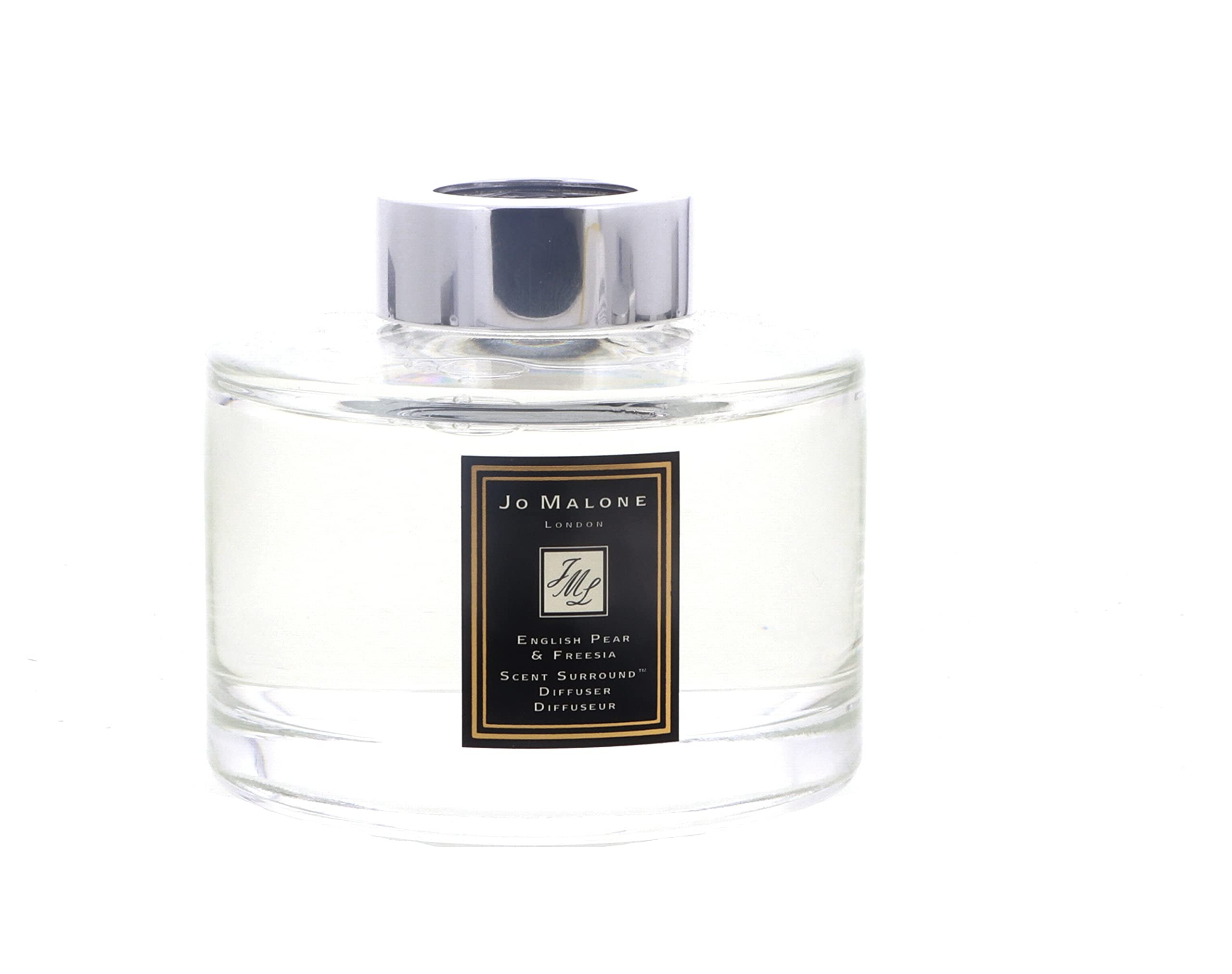Notas de pera y fresias en el difusor Jo Malone para un ambiente elegante.